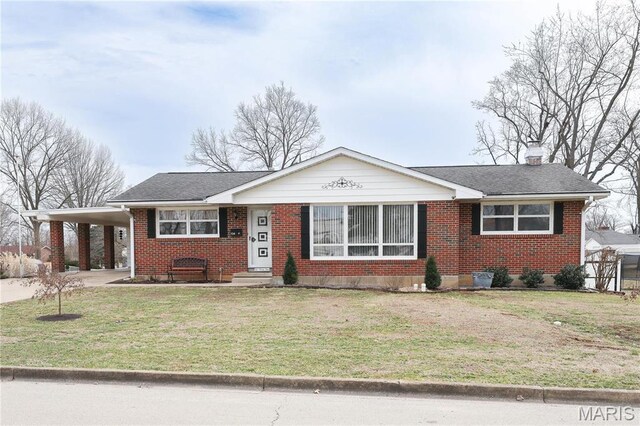 134 Pine St, Farmington, MO 63640 - view of front of property featuring brick siding, a front yard, an attached carport, and a chimney
