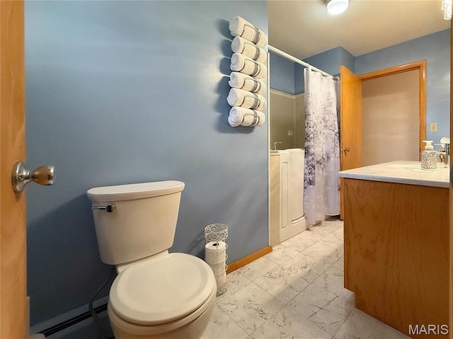 134 Pine St, Farmington, MO 63640 - bathroom with marble look tiles, toilet, vanity, and baseboards