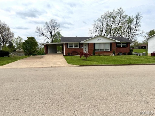 134 Pine St, Farmington, MO 63640 - single story home featuring driveway, brick siding, a carport, a front lawn, and a chimney