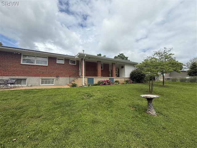 134 Pine St, Farmington, MO 63640 - rear view of house with a lawn and brick siding