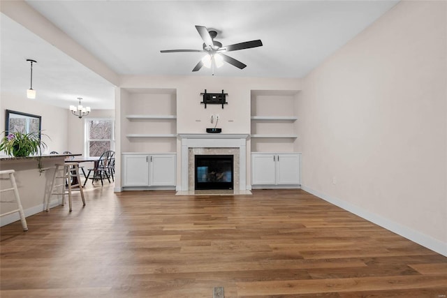 948 Half Moon, Caseyville, IL 62232 - living area featuring baseboards, built in features, and a chandelier
