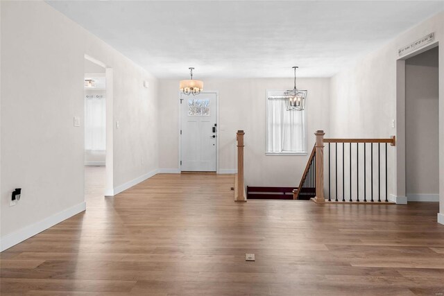 948 Half Moon, Caseyville, IL 62232 - entryway featuring a chandelier, wood finished floors, and baseboards