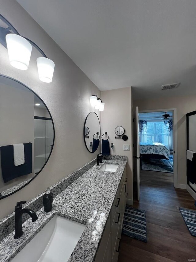 948 Half Moon, Caseyville, IL 62232 - ensuite bathroom with wood finished floors, double vanity, and baseboards