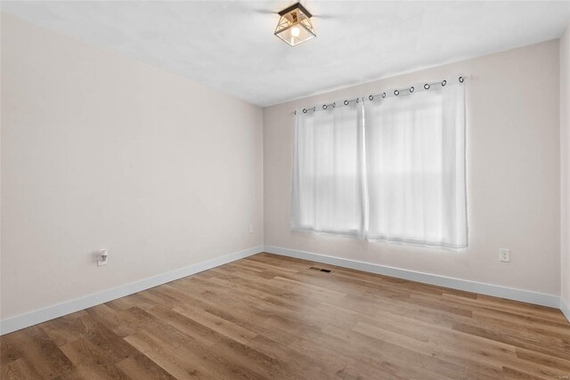 948 Half Moon, Caseyville, IL 62232 - spare room with baseboards and wood finished floors