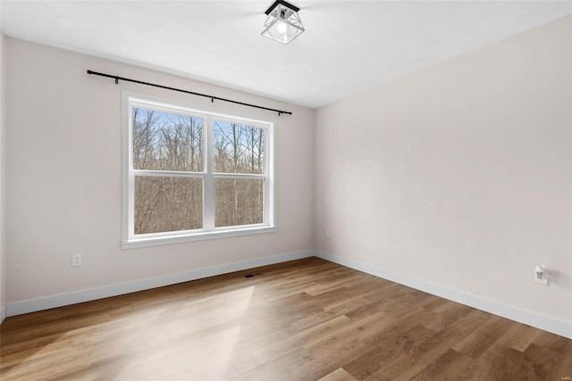 948 Half Moon, Caseyville, IL 62232 - spare room featuring baseboards and wood finished floors