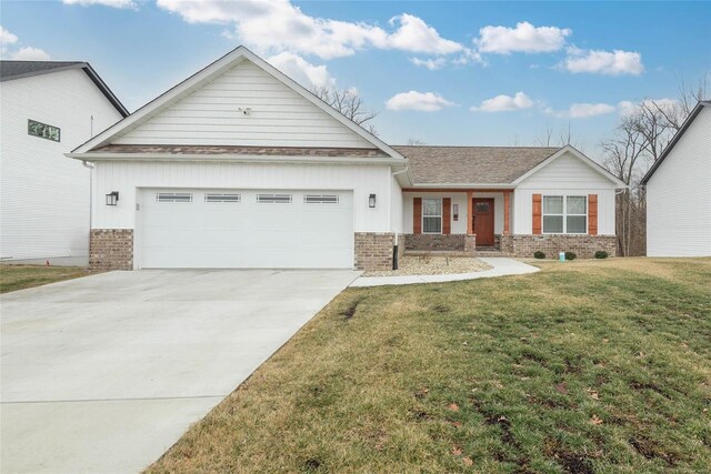 948 Half Moon, Caseyville, IL 62232 - view of front of house featuring brick siding, board and batten siding, a garage, driveway, and a front lawn