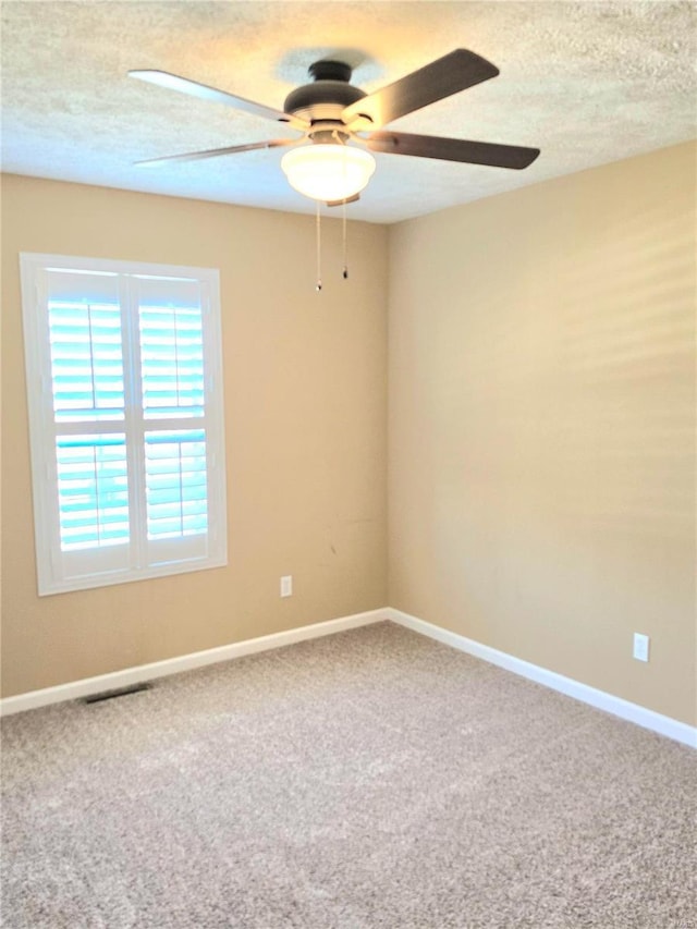 15872 Tundra St, Saint Robert, MO 65584 - spare room featuring ceiling fan, carpet floors, a textured ceiling, and baseboards