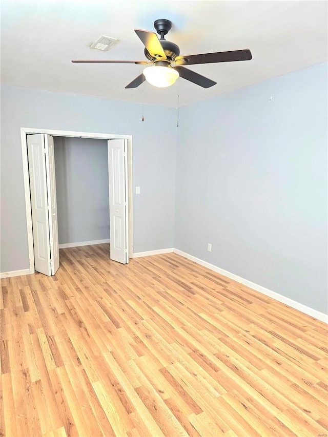 15872 Tundra St, Saint Robert, MO 65584 - unfurnished bedroom with light wood-type flooring, baseboards, a closet, and ceiling fan