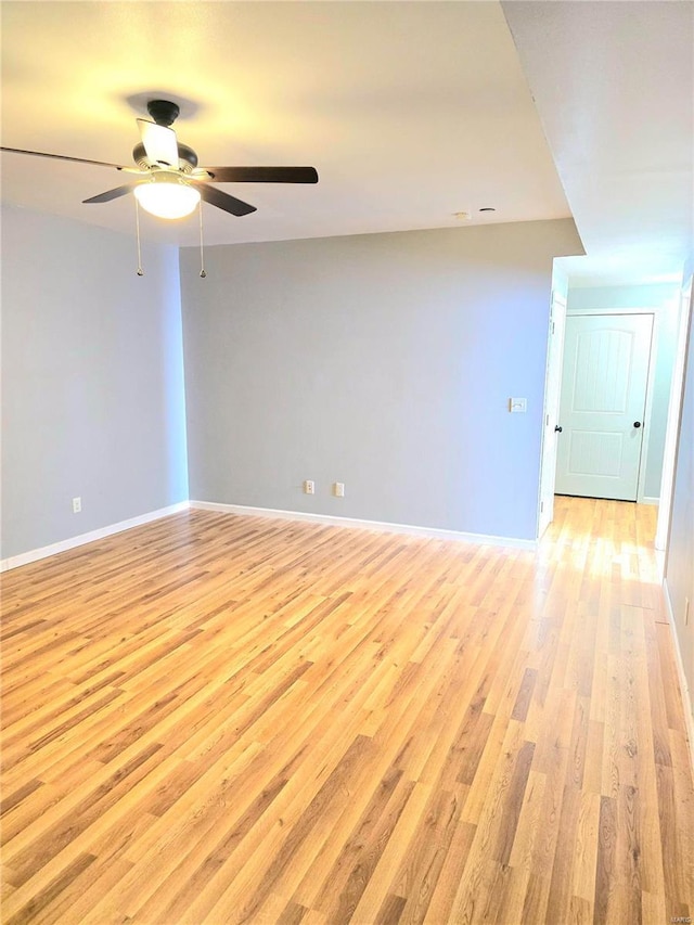 15872 Tundra St, Saint Robert, MO 65584 - empty room with light wood finished floors, a ceiling fan, and baseboards