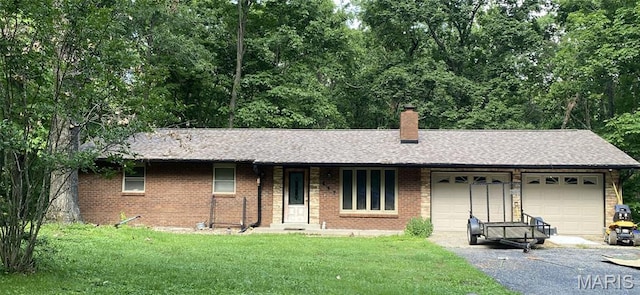 207 Navaho Dr, Cape Girardeau, MO 63701 - single story home featuring an attached garage, asphalt driveway, a chimney, a front yard, and brick siding