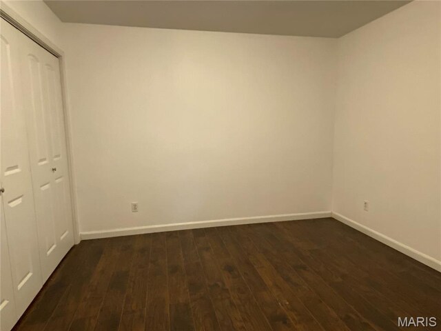 207 Navaho Dr, Cape Girardeau, MO 63701 - unfurnished bedroom featuring dark wood-type flooring and a closet