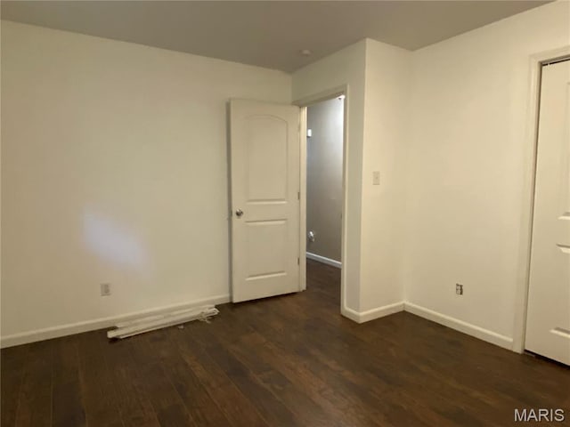 207 Navaho Dr, Cape Girardeau, MO 63701 - spare room with dark wood-type flooring and baseboards