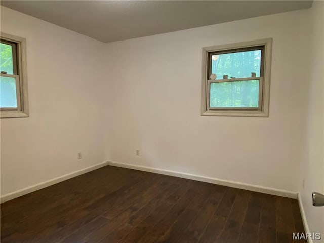 207 Navaho Dr, Cape Girardeau, MO 63701 - spare room with baseboards and dark wood-type flooring