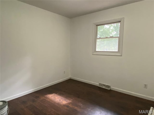 207 Navaho Dr, Cape Girardeau, MO 63701 - unfurnished room featuring baseboards and dark wood-style floors