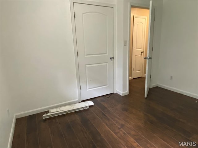 207 Navaho Dr, Cape Girardeau, MO 63701 - unfurnished room with dark wood-style flooring and baseboards