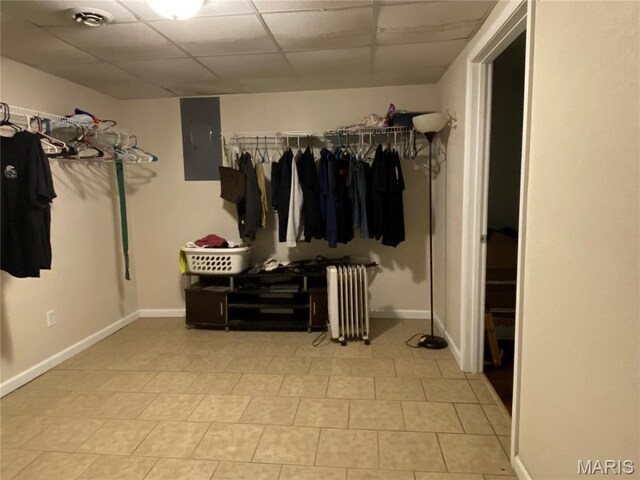 207 Navaho Dr, Cape Girardeau, MO 63701 - walk in closet with radiator, a drop ceiling, electric panel, and tile patterned floors