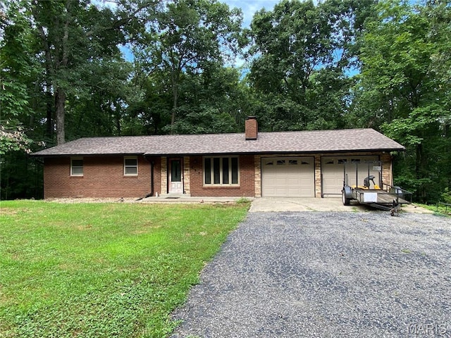 207 Navaho Dr, Cape Girardeau, MO 63701 - single story home featuring an attached garage, a front yard, a chimney, driveway, and brick siding