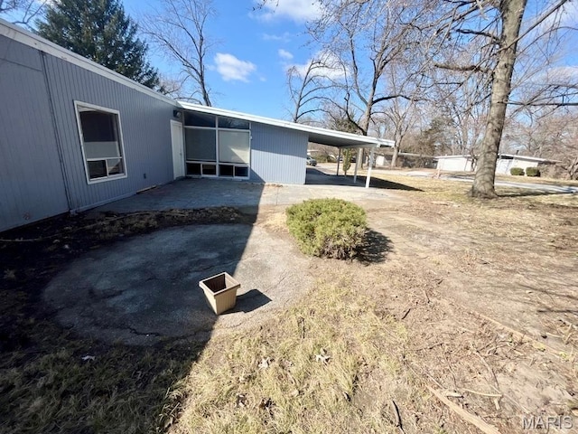 750 Robinwood Dr, Florissant, MO 63033 - rear view of property with an attached carport