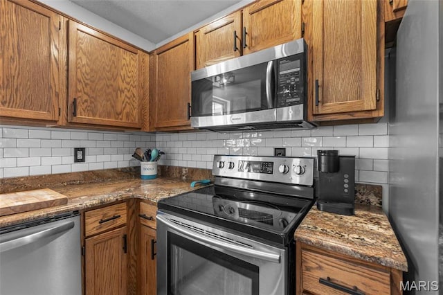 420 Cherokee Dr, Cape Girardeau, MO 63701 - kitchen featuring stainless steel appliances, backsplash, and brown cabinets