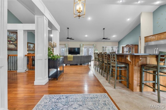 149 Windy Point Ave, Cape Girardeau, MO 63701 - dining area with vaulted ceiling, light wood-style flooring, a ceiling fan, and recessed lighting