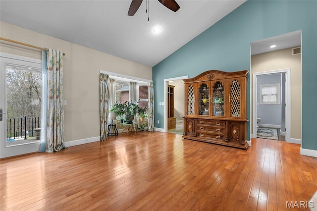 149 Windy Point Ave, Cape Girardeau, MO 63701 - empty room with ceiling fan, wood-type flooring, plenty of natural light, high vaulted ceiling, and baseboards