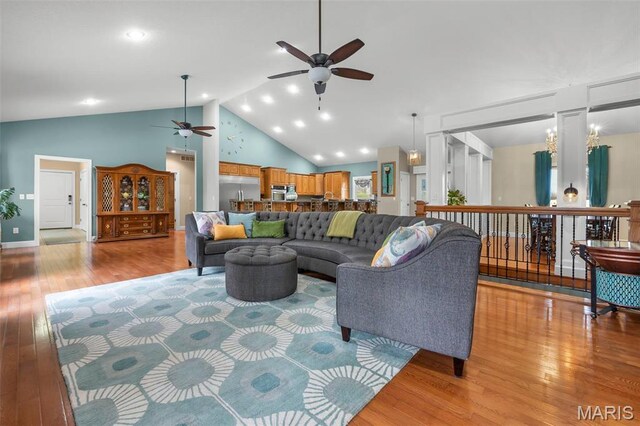 149 Windy Point Ave, Cape Girardeau, MO 63701 - living room with a ceiling fan, light wood-style flooring, and high vaulted ceiling