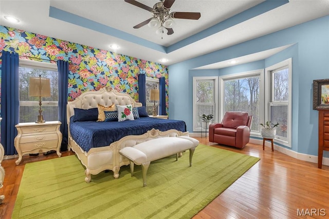 149 Windy Point Ave, Cape Girardeau, MO 63701 - bedroom featuring baseboards, multiple windows, hardwood / wood-style floors, a tray ceiling, and recessed lighting