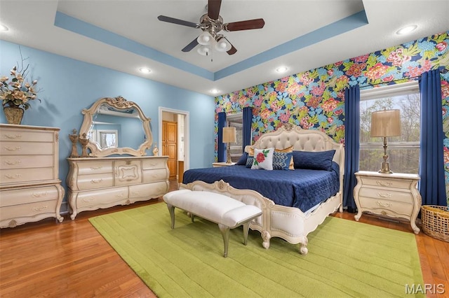 149 Windy Point Ave, Cape Girardeau, MO 63701 - bedroom featuring a tray ceiling, wood finished floors, recessed lighting, a ceiling fan, and ensuite bath