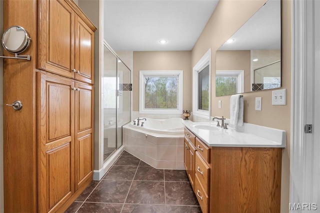 149 Windy Point Ave, Cape Girardeau, MO 63701 - full bath with a stall shower, a bath, vanity, and tile patterned flooring