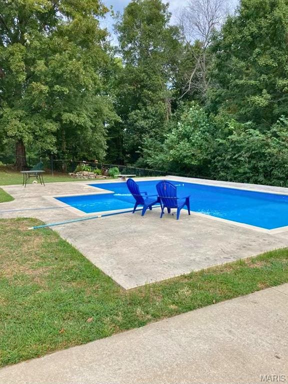 149 Windy Point Ave, Cape Girardeau, MO 63701 - outdoor pool with a patio area and view of scattered trees