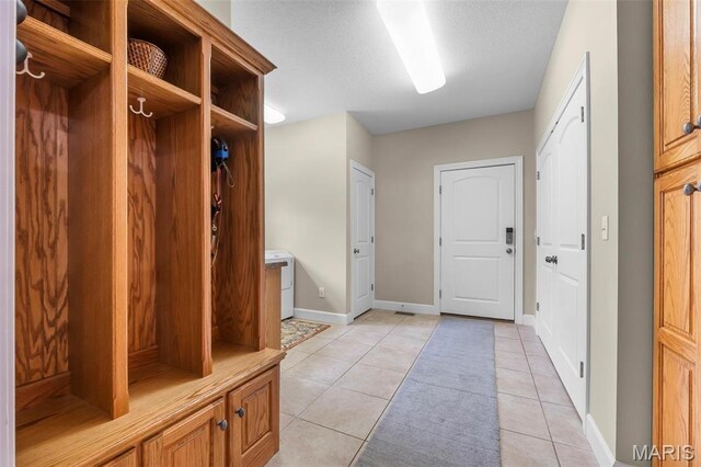149 Windy Point Ave, Cape Girardeau, MO 63701 - mudroom featuring baseboards and light tile patterned flooring