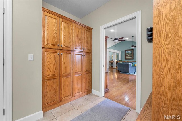 149 Windy Point Ave, Cape Girardeau, MO 63701 - corridor featuring vaulted ceiling, light tile patterned flooring, and baseboards