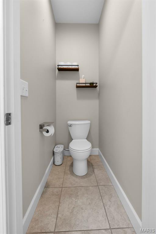 149 Windy Point Ave, Cape Girardeau, MO 63701 - bathroom featuring toilet, tile patterned floors, and baseboards