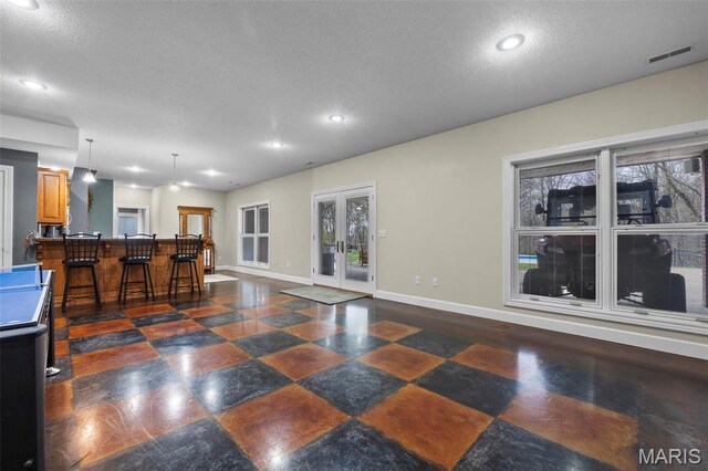 149 Windy Point Ave, Cape Girardeau, MO 63701 - living room with baseboards, french doors, a textured ceiling, and recessed lighting