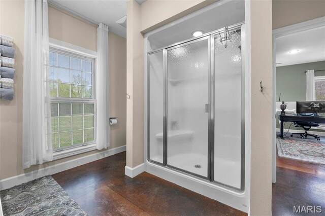 149 Windy Point Ave, Cape Girardeau, MO 63701 - bathroom featuring finished concrete floors, baseboards, and a stall shower