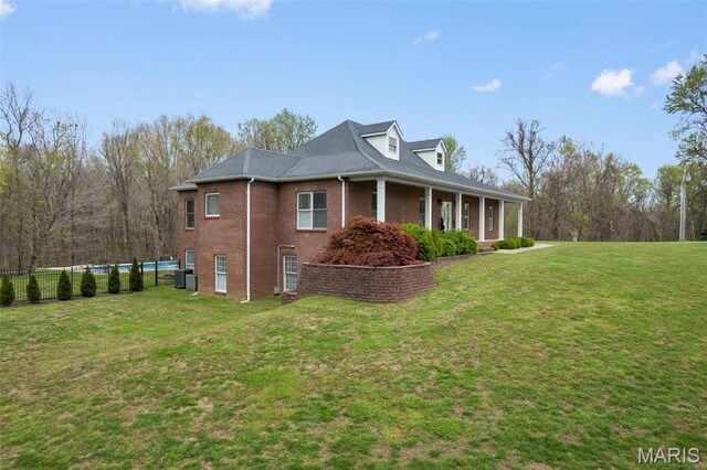 149 Windy Point Ave, Cape Girardeau, MO 63701 - view of side of home featuring brick siding, cooling unit, and a porch