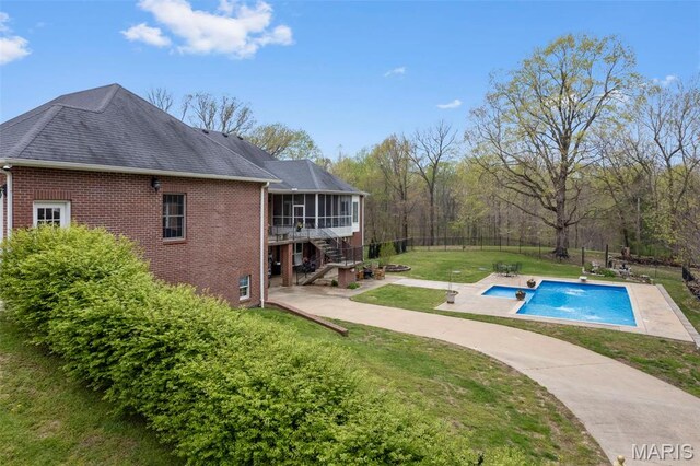 149 Windy Point Ave, Cape Girardeau, MO 63701 - outdoor pool featuring a sunroom, stairway, a patio area, and a yard