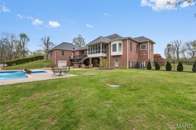 149 Windy Point Ave, Cape Girardeau, MO 63701 - rear view of house featuring a sunroom, brick siding, a patio area, and stairs