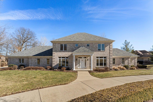230 W Waters Edge Dr, Belleville, IL 62221 - colonial house with a front lawn, brick siding, and a shingled roof