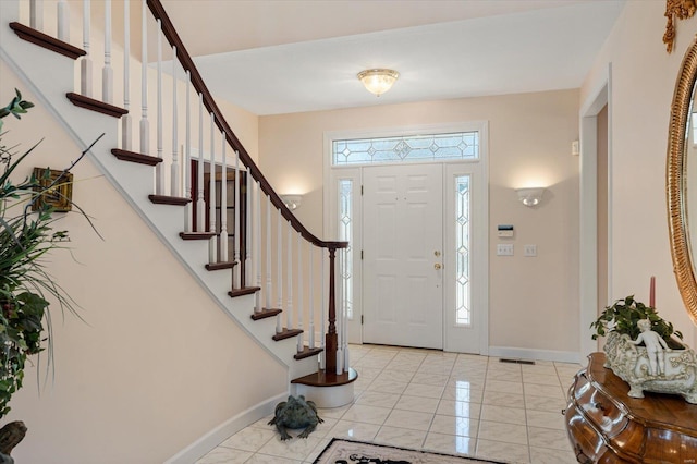 230 W Waters Edge Dr, Belleville, IL 62221 - foyer entrance featuring light marble finish floors, baseboards, and stairway