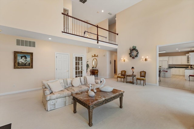 230 W Waters Edge Dr, Belleville, IL 62221 - living area with a high ceiling, light carpet, baseboards, and recessed lighting
