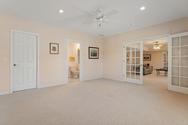 230 W Waters Edge Dr, Belleville, IL 62221 - unfurnished bedroom with french doors, light colored carpet, baseboards, and recessed lighting