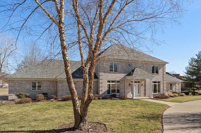 230 W Waters Edge Dr, Belleville, IL 62221 - colonial inspired home featuring brick siding and a front yard
