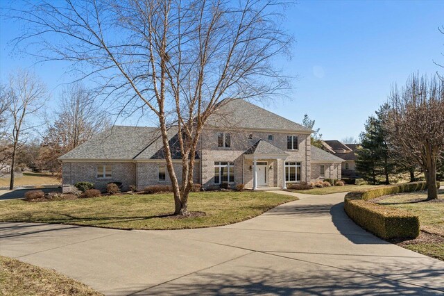 230 W Waters Edge Dr, Belleville, IL 62221 - view of front facade featuring brick siding and a front yard