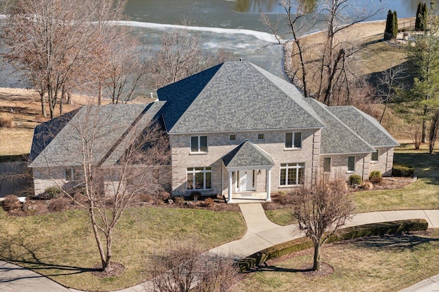 230 W Waters Edge Dr, Belleville, IL 62221 - view of front of home featuring roof with shingles and a front lawn