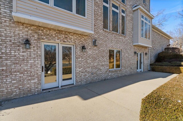 230 W Waters Edge Dr, Belleville, IL 62221 - doorway to property with a patio and brick siding
