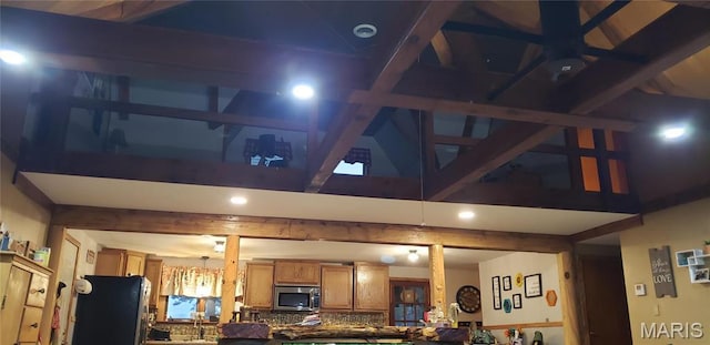 18480 State Route O, Rolla, MO 65401 - kitchen featuring stainless steel appliances, high vaulted ceiling, brown cabinetry, and beam ceiling