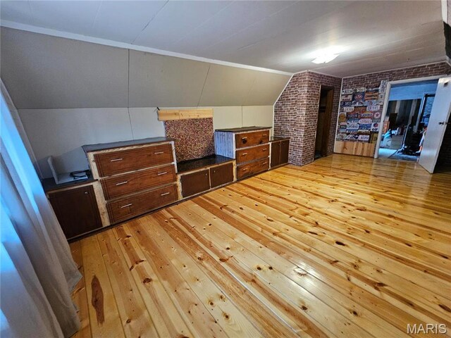 18480 State Route O, Rolla, MO 65401 - additional living space with light wood-style floors, brick wall, and vaulted ceiling