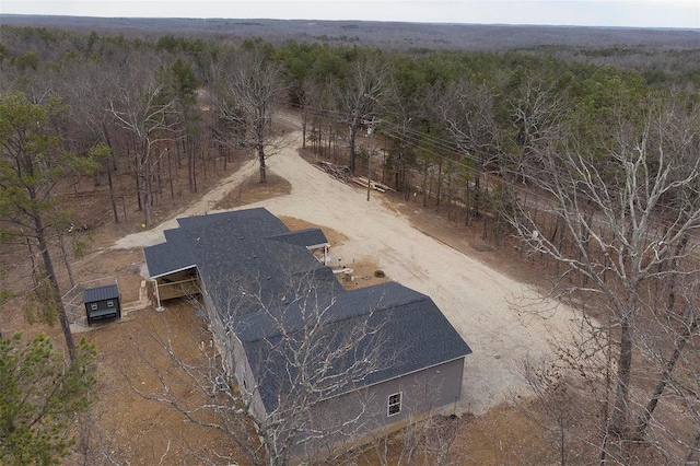 view from above of property with a forest