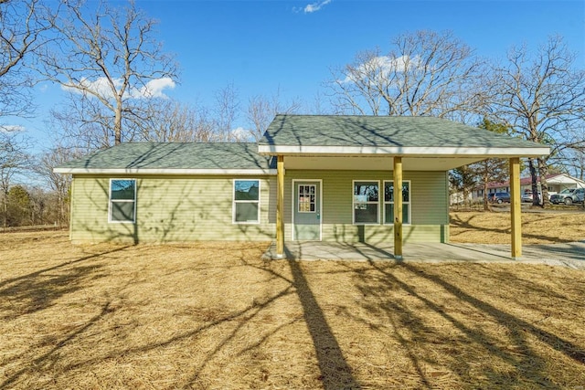 1510 N Mapleshade Rd, Cuba, MO 65453 - back of house with a porch and roof with shingles